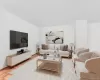 Living area featuring baseboards and parquet floors Living area featuring baseboards and parquet floors