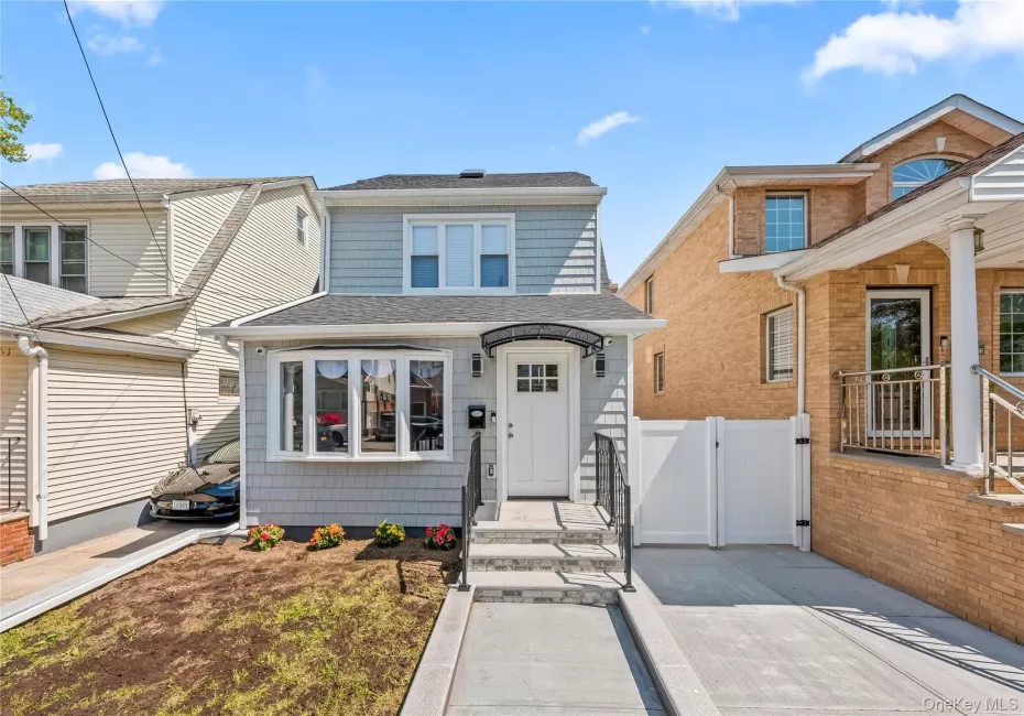 Front of this Beautiful Home Featuring Bay Window Overlook, New Staircase, Custom Railing, and Awning Front of this Beautiful Home Featuring Bay Window Overlook, New Staircase, Custom Railing, and Awning