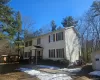 Colonial-style house featuring an outbuilding Colonial-style house featuring an outbuilding