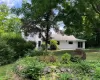 Welcome to 17 Montrose Station Road, tucked away from the road in a peaceful green oasis. Surrounded by lush greenery and seasonal color, the entrance feels both private and inviting. Welcome to 17 Montrose Station Road, tucked away from the road in a peaceful green oasis. Surrounded by lush greenery and seasonal color, the entrance feels both private and inviting.