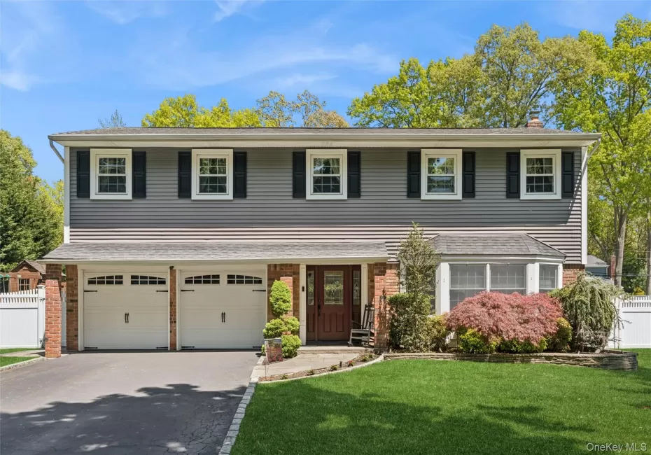 Professionally landscaped, outdoor lighting. New garage doors. Professionally landscaped, outdoor lighting. New garage doors.