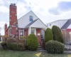 View of front of house with brick siding and a chimney View of front of house with brick siding and a chimney