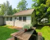 Wooden terrace featuring a yard Wooden terrace featuring a yard