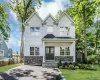 Contemporary NEw construciton two-story residence with white siding and a dark gray stone facade accent Contemporary NEw construciton two-story residence with white siding and a dark gray stone facade accent