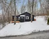 View of snowy exterior with a deck View of snowy exterior with a deck