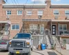 Traditional-style house with brick siding and stairway Traditional-style house with brick siding and stairway
