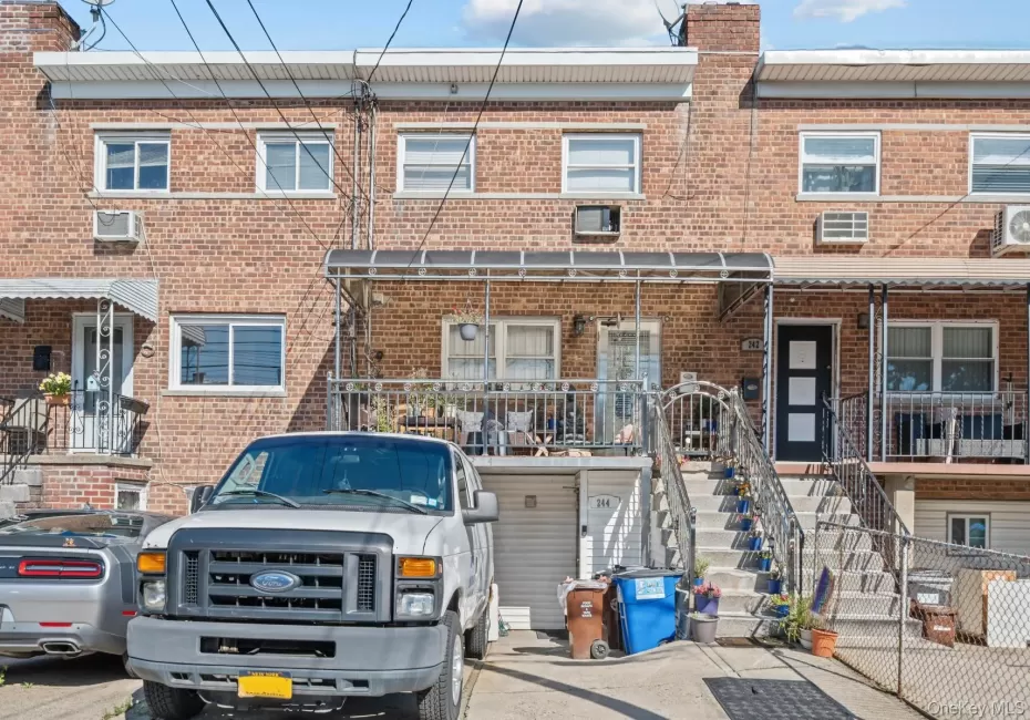 Traditional-style house with brick siding and stairway Traditional-style house with brick siding and stairway