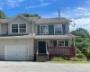 View of front facade featuring a garage View of front facade featuring a garage