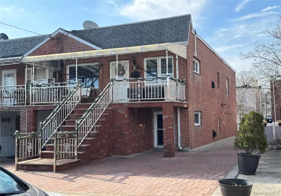 View of building exterior featuring stairway View of building exterior featuring stairway