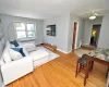 The large living room has hardwood floors and opens to the dining are and entry foyer. The living area and dining area is approx 20'-4" x 11'-5". The large living room has hardwood floors and opens to the dining are and entry foyer. The living area and dining area is approx 20'-4" x 11'-5".