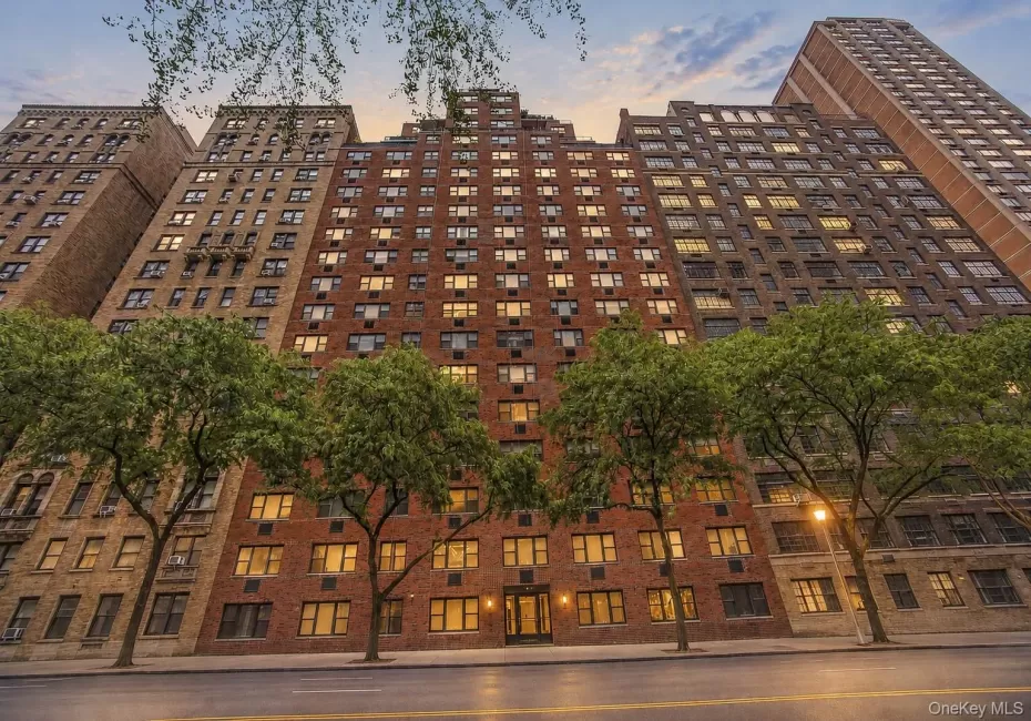 Multi-story brick facade building featuring a stepped architectural design Multi-story brick facade building featuring a stepped architectural design