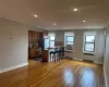 Kitchen with a breakfast bar area, stainless steel appliances, radiator, backsplash, and ornamental molding Kitchen with a breakfast bar area, stainless steel appliances, radiator, backsplash, and ornamental molding