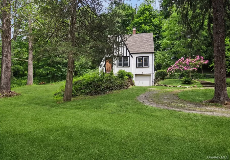 Charming Tudor w/ striking curb appeal Charming Tudor w/ striking curb appeal