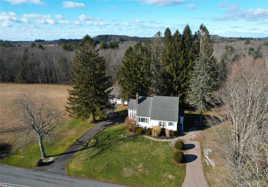 Aerial overview of property's location featuring a heavily wooded area Aerial overview of property's location featuring a heavily wooded area