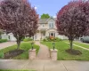 Two-story residence featuring expansive paver stone entry walkway Two-story residence featuring expansive paver stone entry walkway