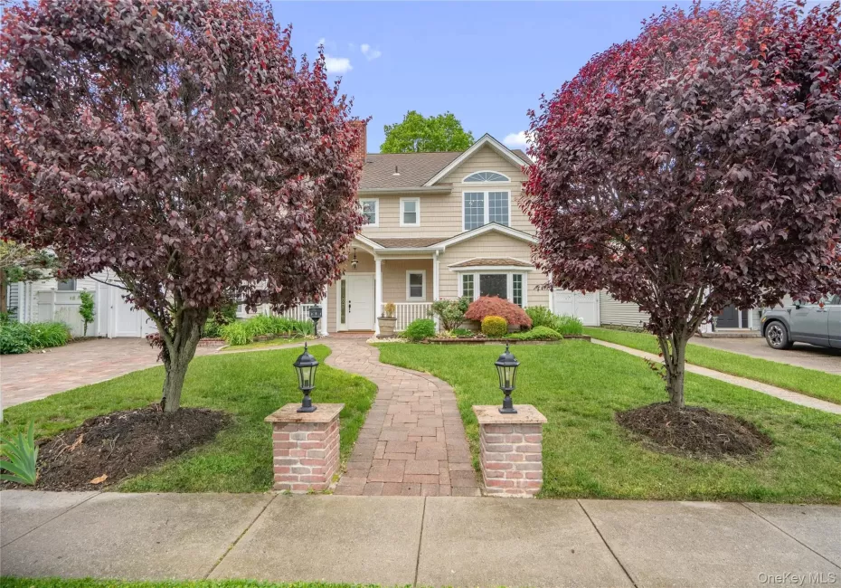 Two-story residence featuring expansive paver stone entry walkway Two-story residence featuring expansive paver stone entry walkway
