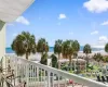 Balcony featuring view of water and beach Balcony featuring view of water and beach