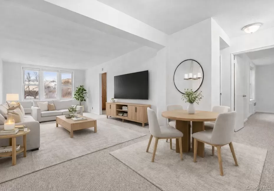 Virtually staged. Living area with light carpet and a chandelier Virtually staged. Living area with light carpet and a chandelier