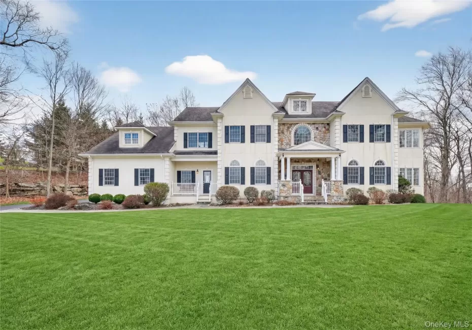 Stately five-bedroom colonial overlooks an expansive lawn. This house is located on the cul-de-sac. Stately five-bedroom colonial overlooks an expansive lawn. This house is located on the cul-de-sac.