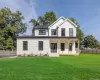 Modern farmhouse style home featuring a porch and board and batten siding Modern farmhouse style home featuring a porch and board and batten siding
