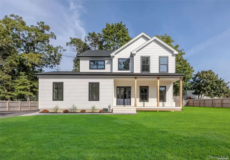 Modern farmhouse style home featuring a porch and board and batten siding Modern farmhouse style home featuring a porch and board and batten siding