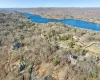 Aerial view of property's location featuring a heavily wooded area Aerial view of property's location featuring a heavily wooded area