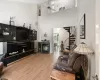 Large open concept living room with vaulted ceiling and wood-burning fireplace Large open concept living room with vaulted ceiling and wood-burning fireplace