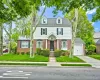 Traditional Gross Morton Model residence featuring white siding and brick veneer Traditional Gross Morton Model residence featuring white siding and brick veneer