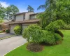 Exterior featuring a sloped roofline, attached garage, and a paved driveway Exterior featuring a sloped roofline, attached garage, and a paved driveway