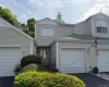 Covered entrance lined with mature shrubs. Covered entrance lined with mature shrubs.
