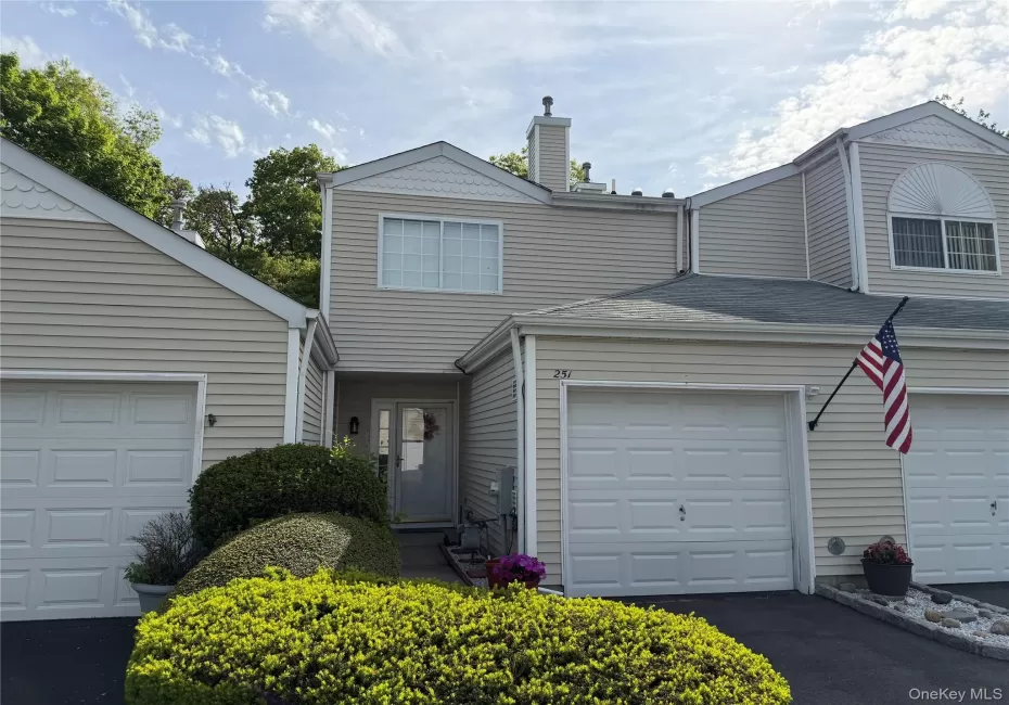 Covered entrance lined with mature shrubs. Covered entrance lined with mature shrubs.