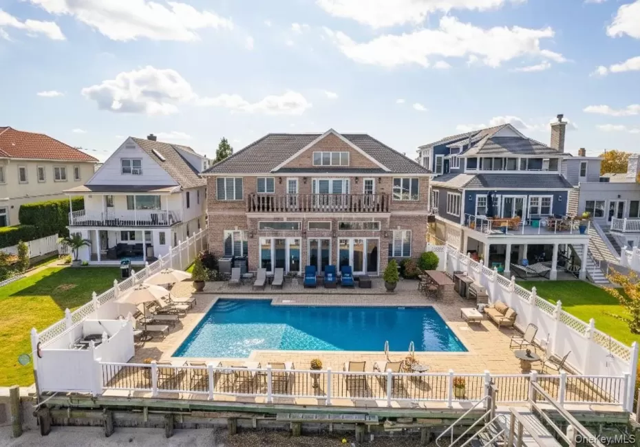Back of property with a patio, a balcony, and a fenced backyard Back of property with a patio, a balcony, and a fenced backyard