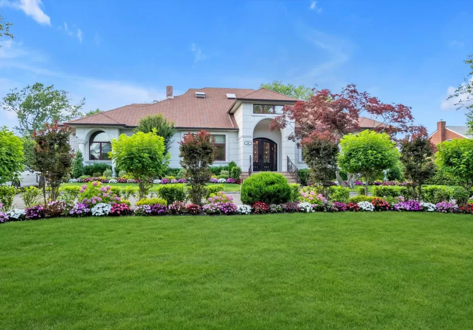 View of front of property with french doors, a chimney, and a front lawn View of front of property with french doors, a chimney, and a front lawn