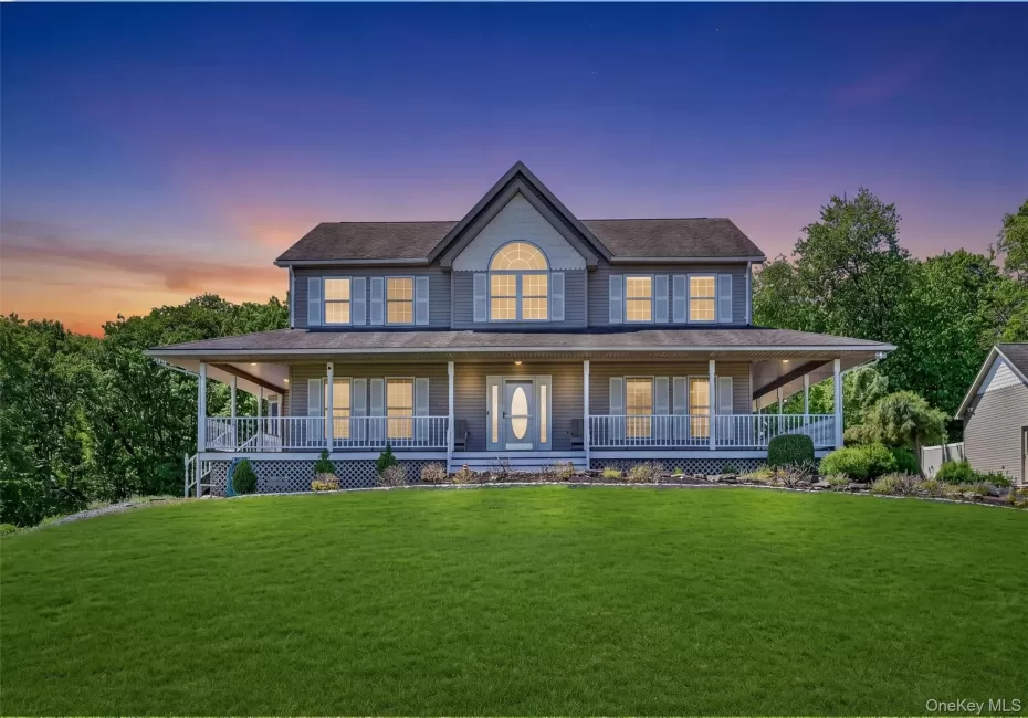 Welcome to 954 Ridgebury Road in New Hampton, NY, a beautiful 44+ acre retreat that feels private and tucked away, yet is just 10 minutes from everyday conveniences. This twilight view captures the home’s warm and inviting first impression, with glowing windows, a wide front porch, and a peaceful setting that immediately sets the tone for the property. Welcome to 954 Ridgebury Road in New Hampton, NY, a beautiful 44+ acre retreat that feels private and tucked away, yet is just 10 minutes from everyday conveniences. This twilight view captures the home’s warm and inviting first impression, with glowing windows, a wide front porch, and a peaceful setting that immediately sets the tone for the property.