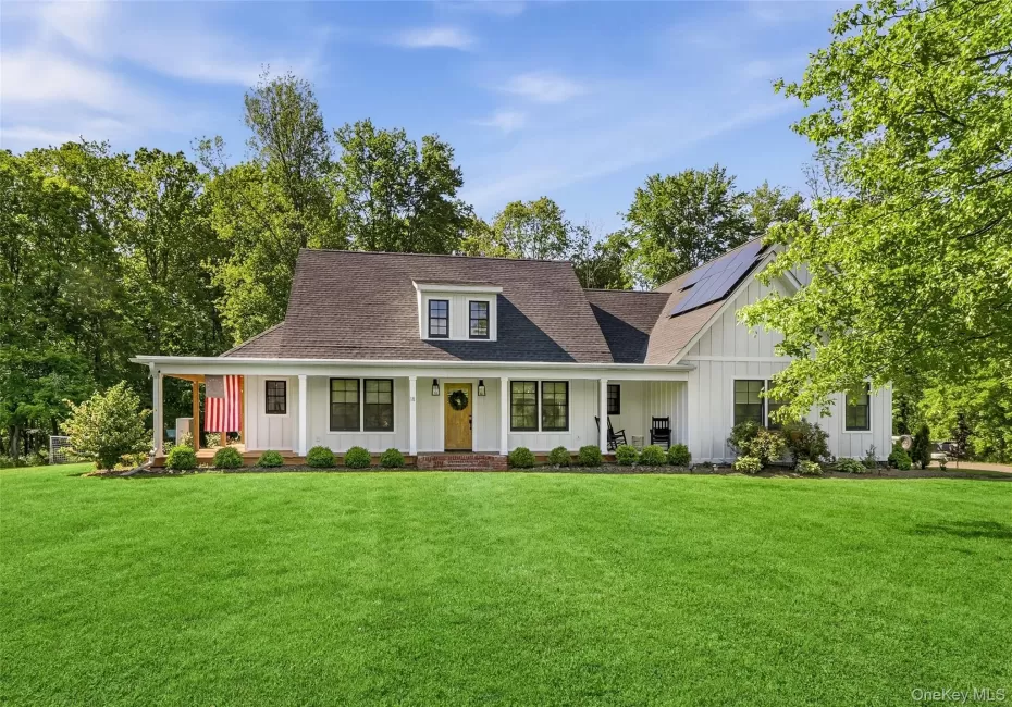 Font exterior showcasing the modern farmhouse design and expansive front lawn Font exterior showcasing the modern farmhouse design and expansive front lawn
