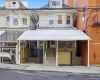 View of front of house featuring stairs and a garage View of front of house featuring stairs and a garage