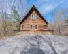 View of home's exterior featuring a wooden deck View of home's exterior featuring a wooden deck