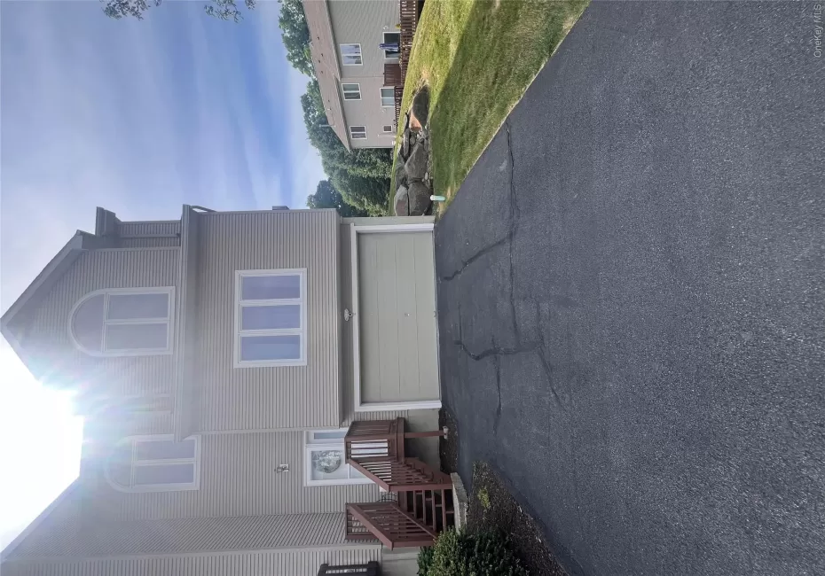 Beautiful Front with 2 car garage and ample driveway fits 4 cars. Beautiful Front with 2 car garage and ample driveway fits 4 cars.