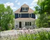 View of front of house featuring covered porch and roof with shingles View of front of house featuring covered porch and roof with shingles