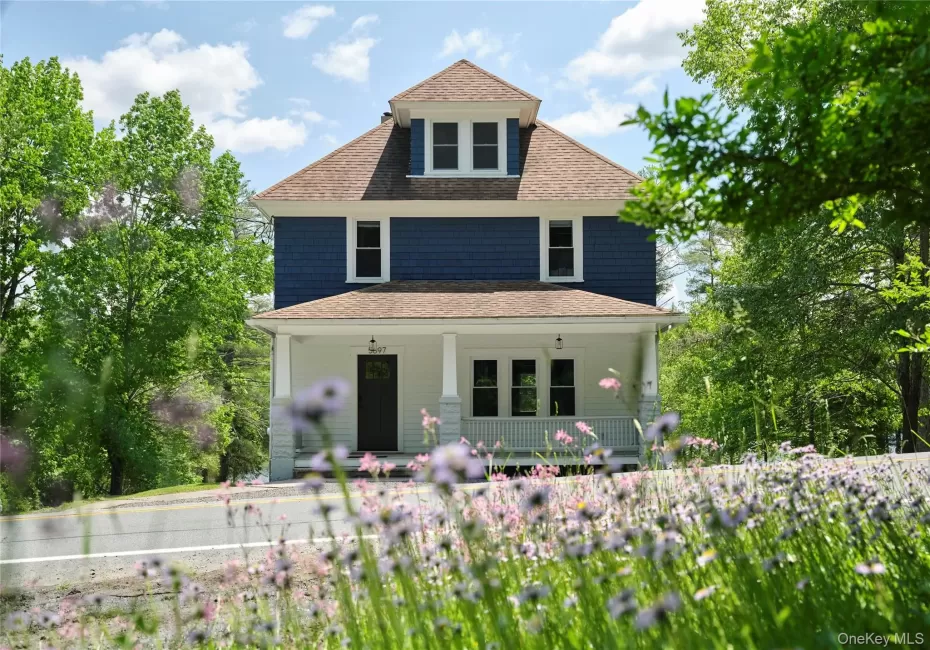 View of front of house featuring covered porch and roof with shingles View of front of house featuring covered porch and roof with shingles