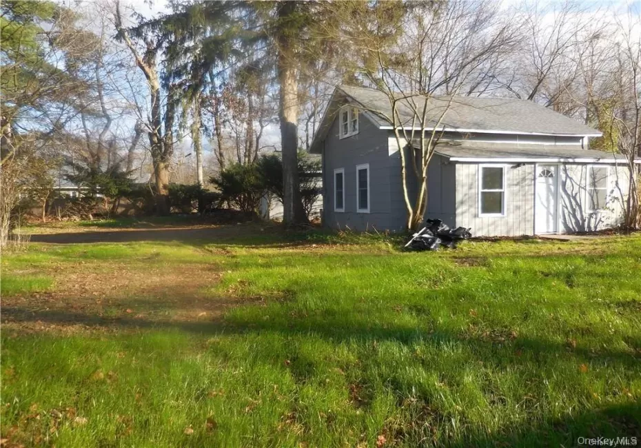 Front and side view of the house & the view of the garage and parking area. Front and side view of the house & the view of the garage and parking area.