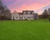 Twilight exterior showcasing the home’s expansive open grounds and peaceful Hudson Valley setting Twilight exterior showcasing the home’s expansive open grounds and peaceful Hudson Valley setting