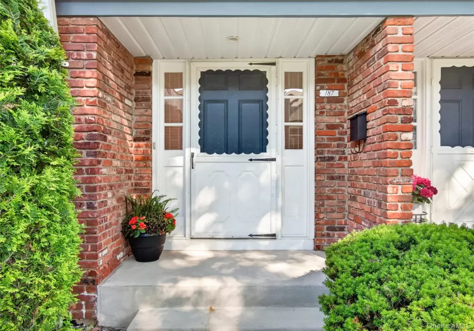Welcoming covered front entrance with attractive brick exterior and mature landscaping. Welcoming covered front entrance with attractive brick exterior and mature landscaping.