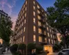 Brick building exterior featuring multiple levels Brick building exterior featuring multiple levels