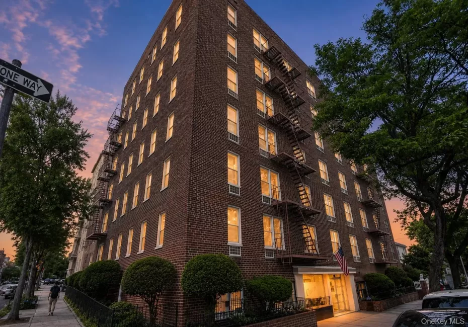 Brick building exterior featuring multiple levels Brick building exterior featuring multiple levels