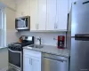 New Kitchen with Granite Counters, Stainless Steel Appliances including a dishwasher, microwave, rang and refrigerator. New Kitchen with Granite Counters, Stainless Steel Appliances including a dishwasher, microwave, rang and refrigerator.