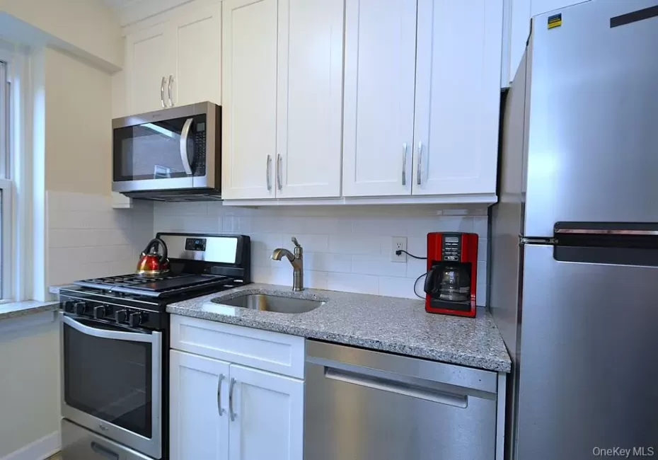 New Kitchen with Granite Counters, Stainless Steel Appliances including a dishwasher, microwave, rang and refrigerator. New Kitchen with Granite Counters, Stainless Steel Appliances including a dishwasher, microwave, rang and refrigerator.