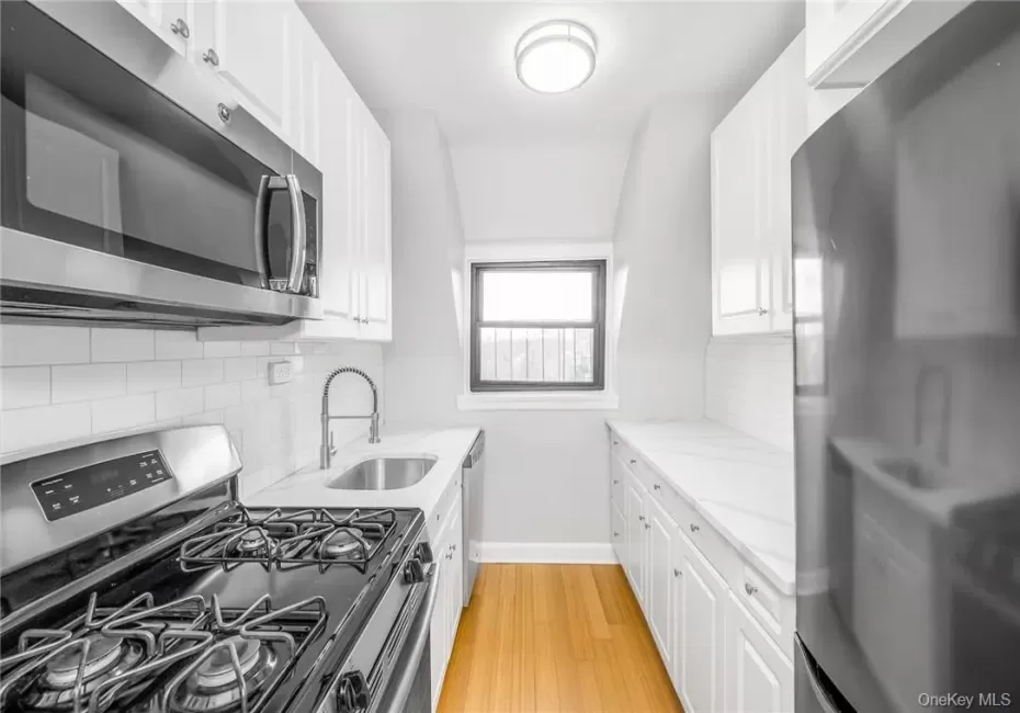 Renovated Kitchen w/Stainless Steel Appliances, Quartz Countertops & Dining Area Renovated Kitchen w/Stainless Steel Appliances, Quartz Countertops & Dining Area