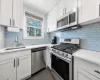 Renovated kitchen has stainless steel appliances Renovated kitchen has stainless steel appliances