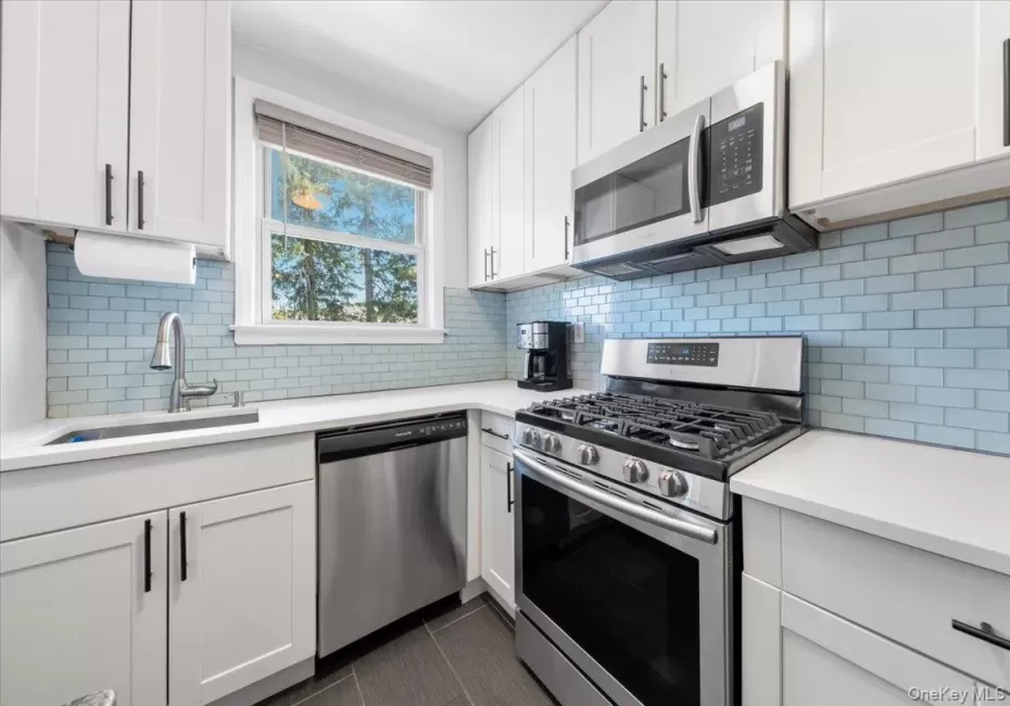 Renovated kitchen has stainless steel appliances Renovated kitchen has stainless steel appliances